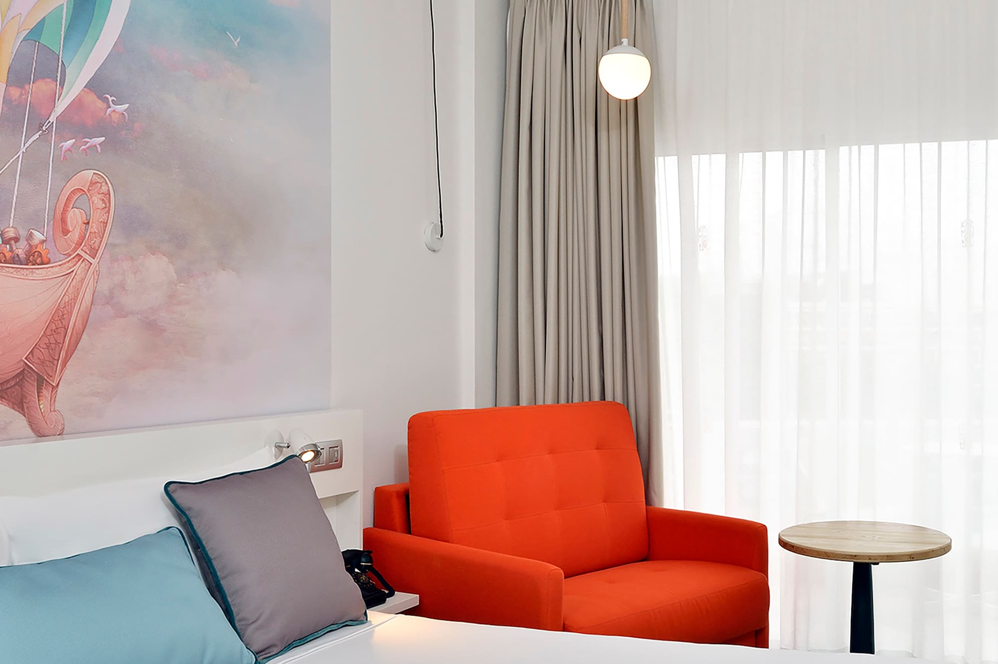 a room with a bed and chair