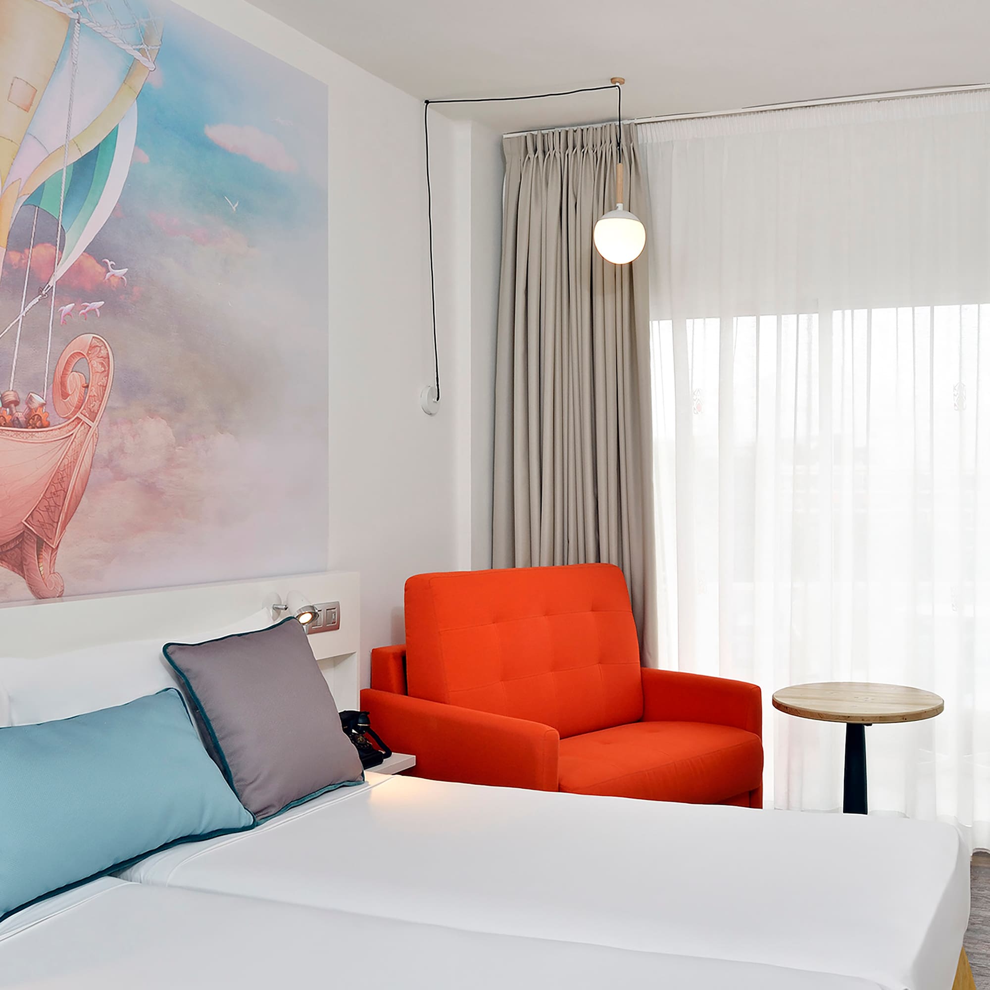 a room with a bed and chair