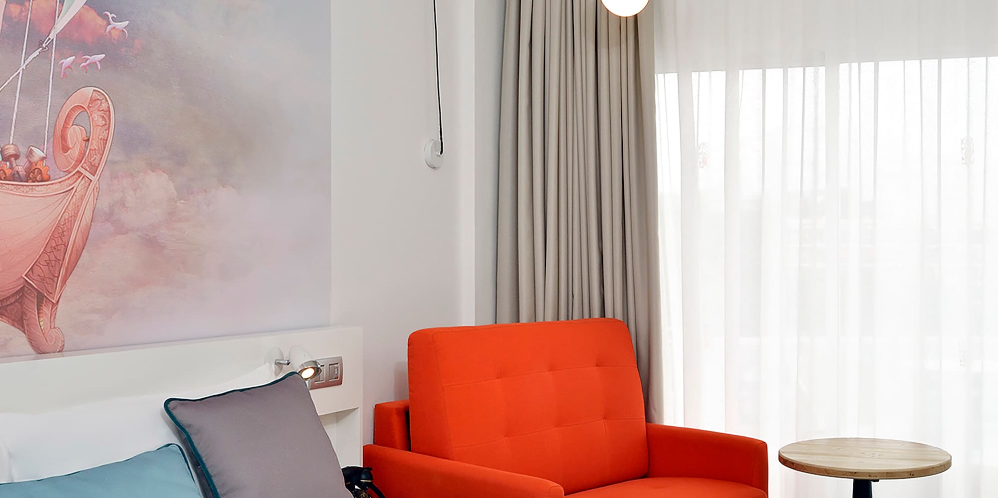 a room with a bed and chair