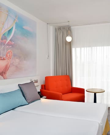 a room with a bed and chair