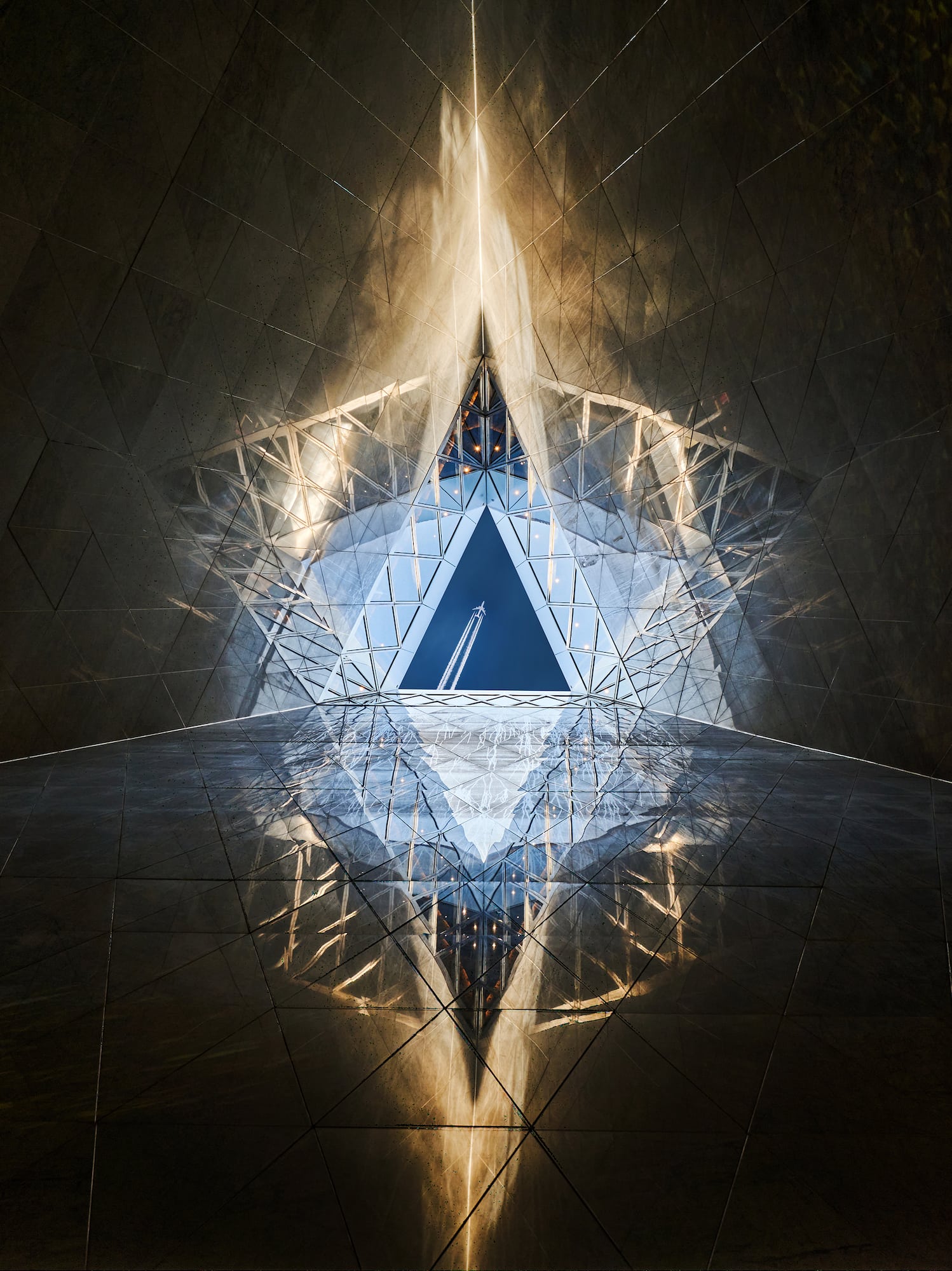 a triangular shaped glass window