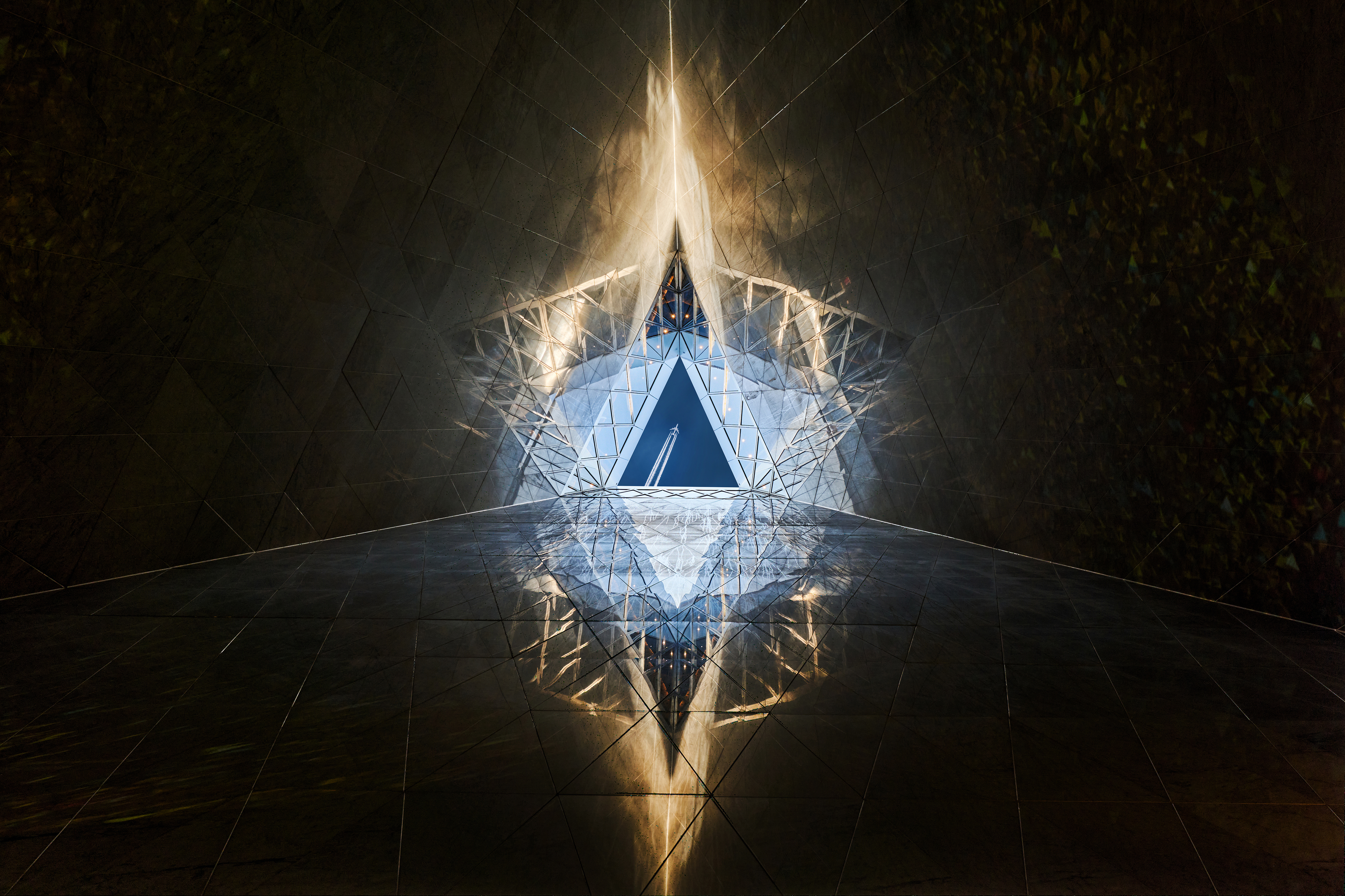 a triangular shaped glass window