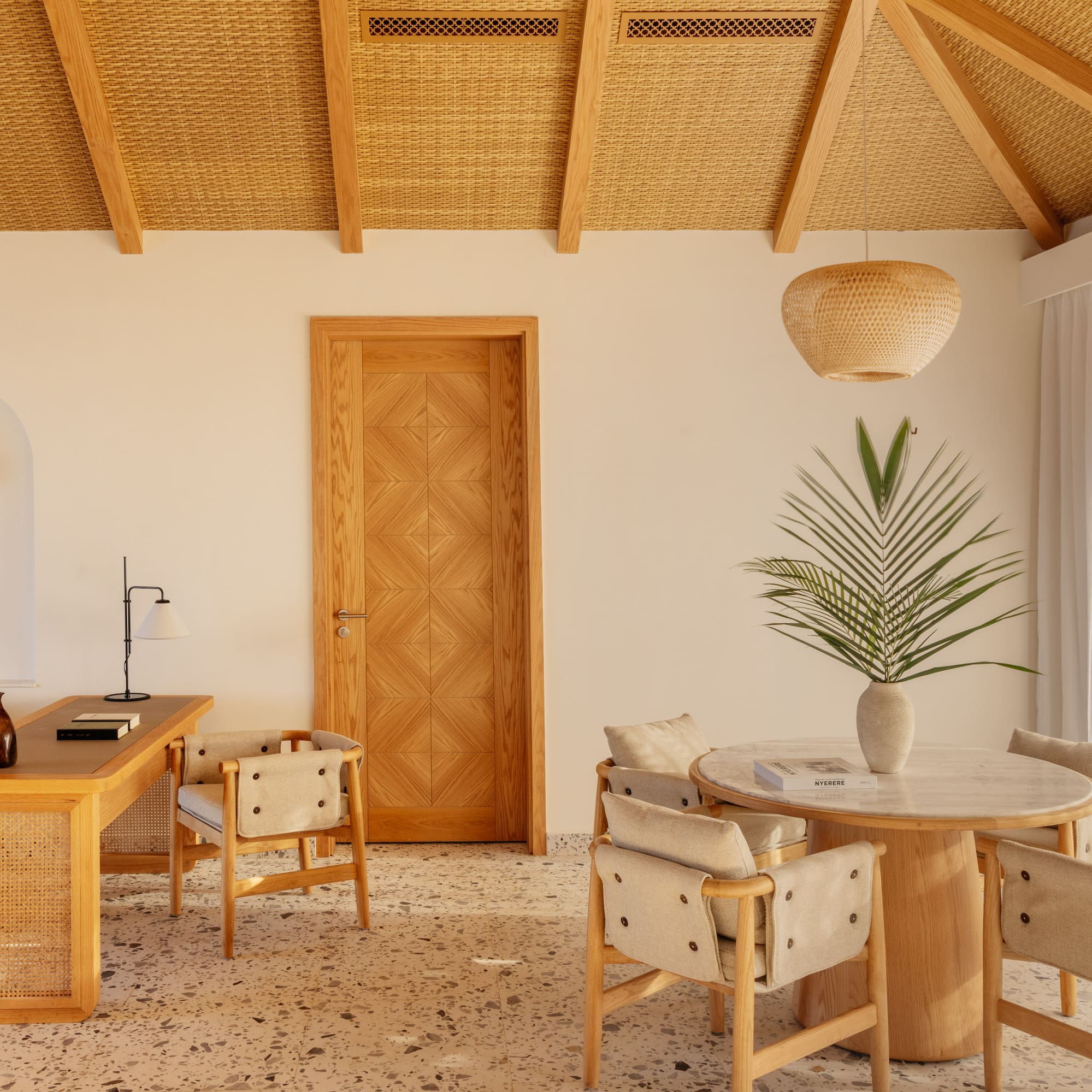 a room with a table and chairs