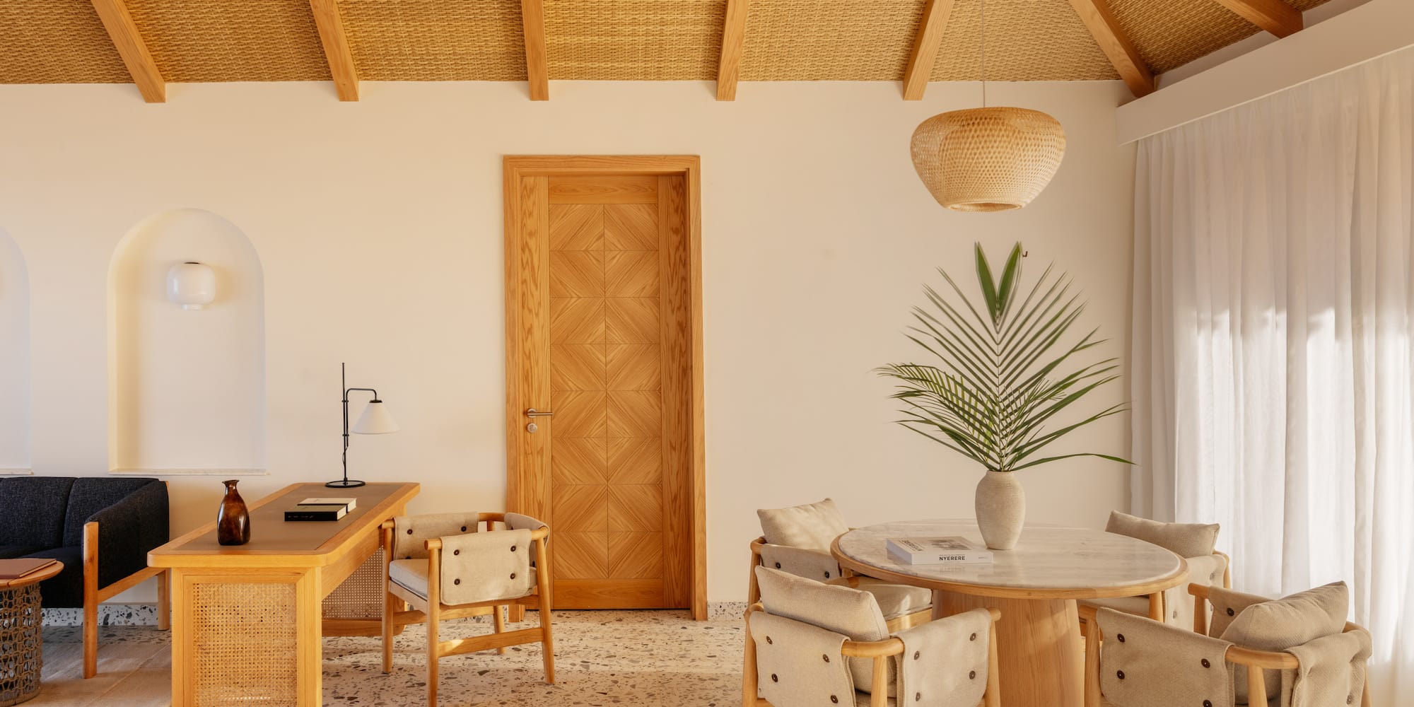 a room with a table and chairs