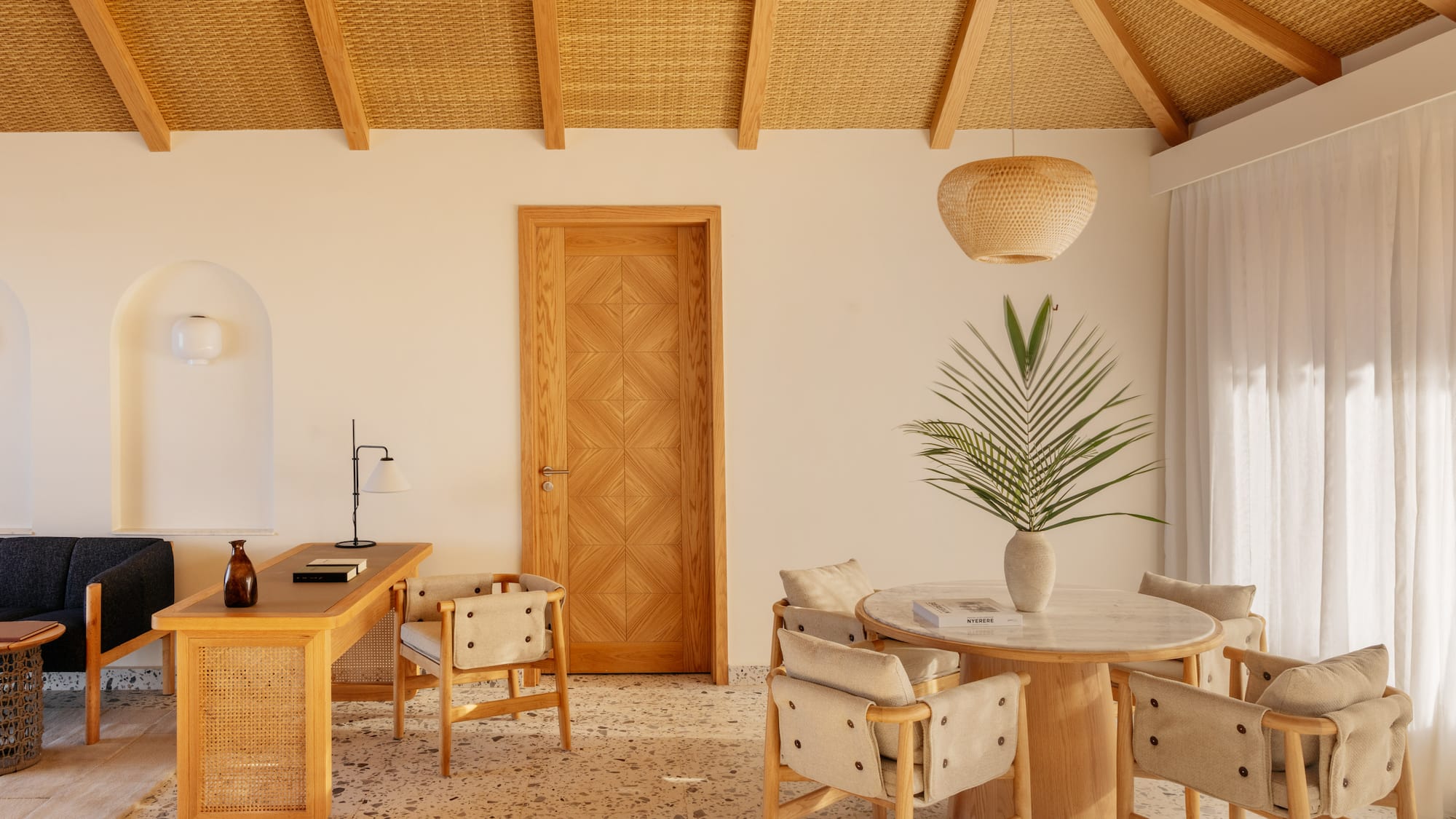 a room with a table and chairs