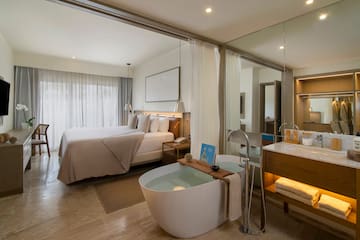 a room with a bed and a bathtub