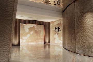 a room with a marble floor and a large doorway