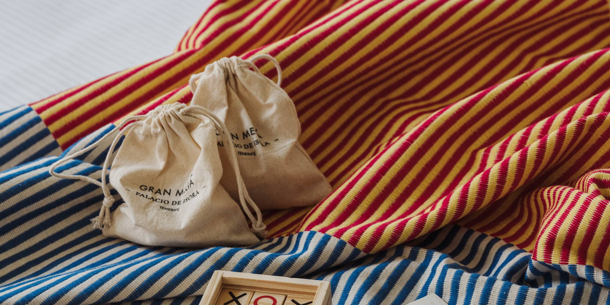 a wooden blocks and bags on a bed