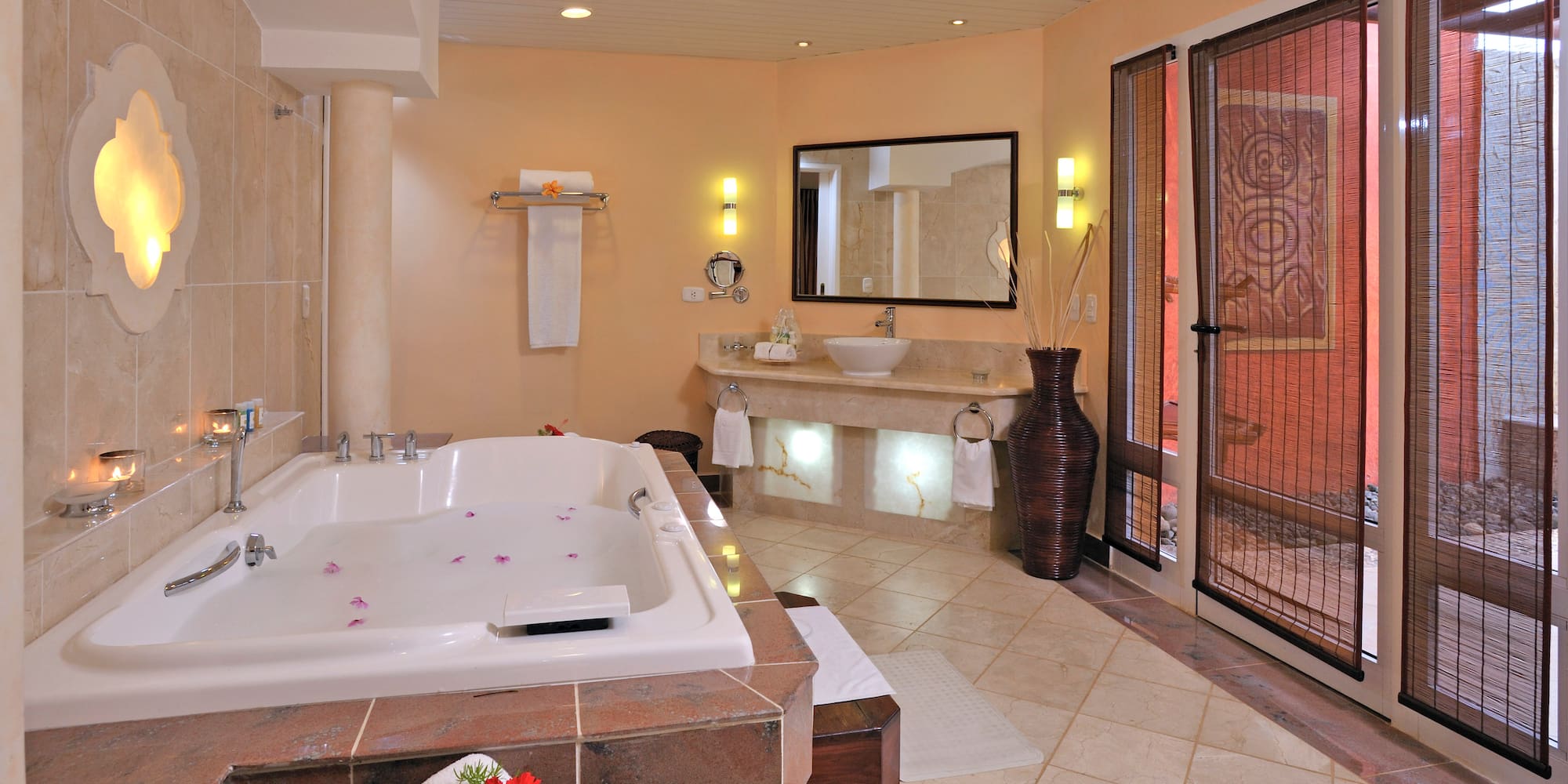 a bathroom with a large tub and sinks