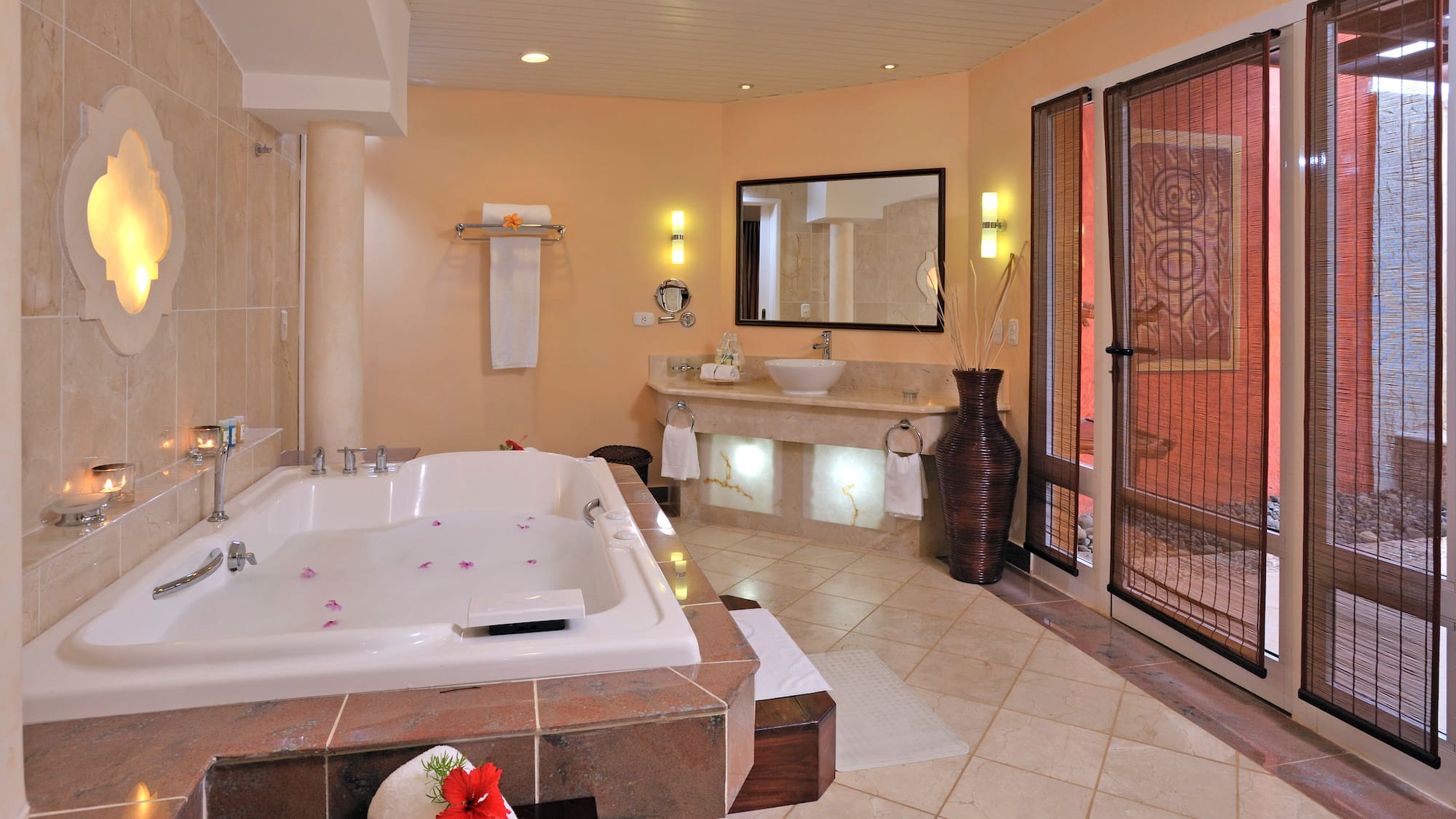 a bathroom with a large tub and sinks