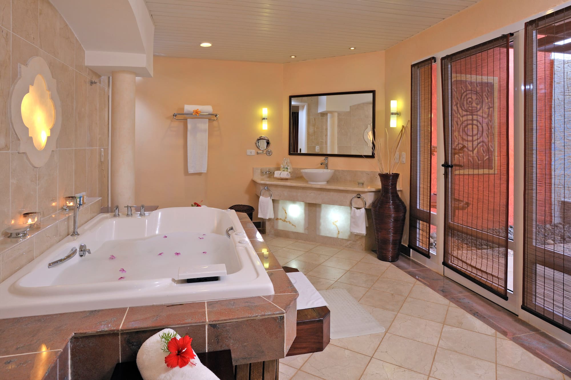 a bathroom with a large tub and sinks