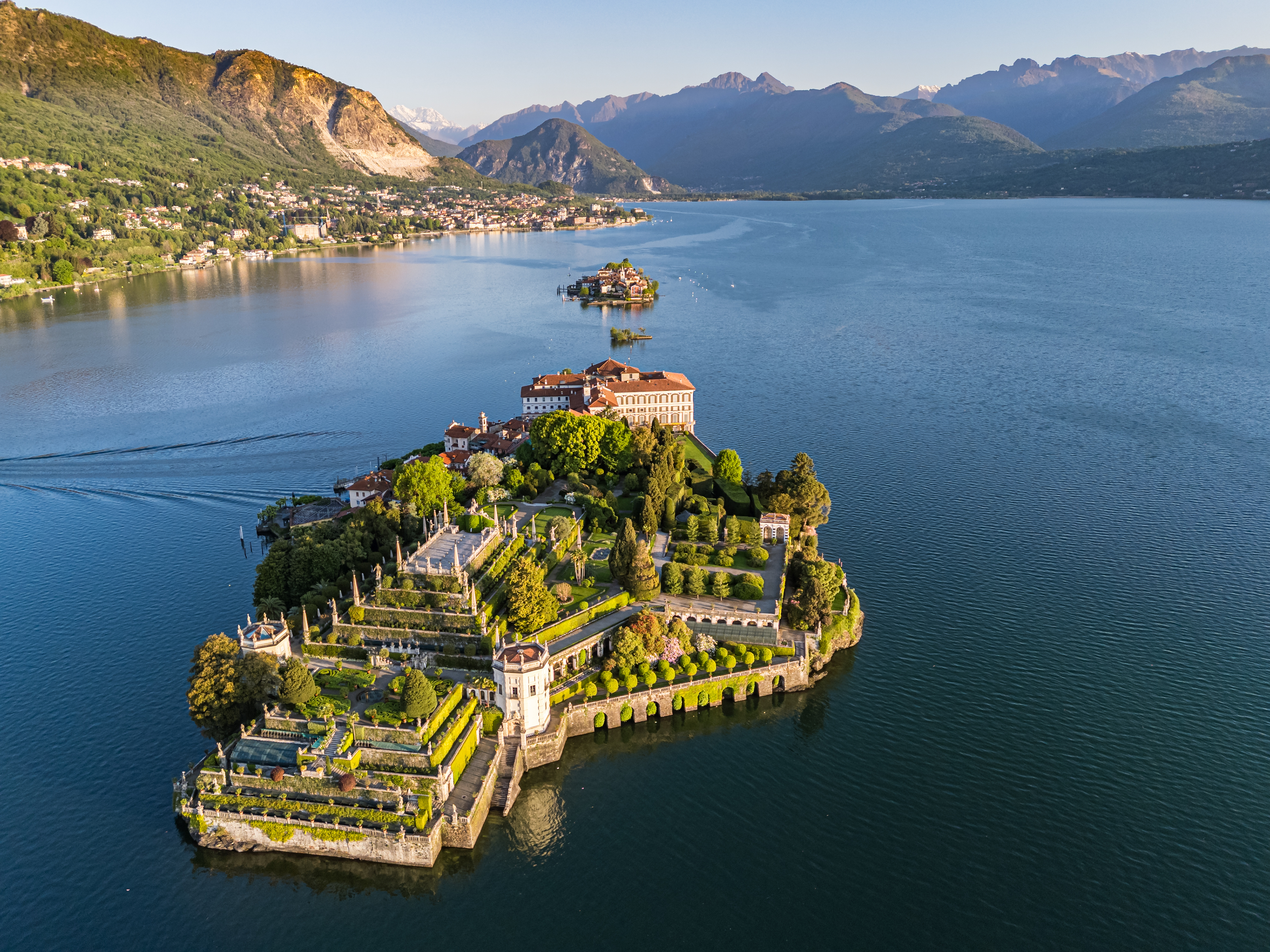 Isola Bella, Lake Maggiore: Baroque palace, elaborate terraced gardens, mountains.