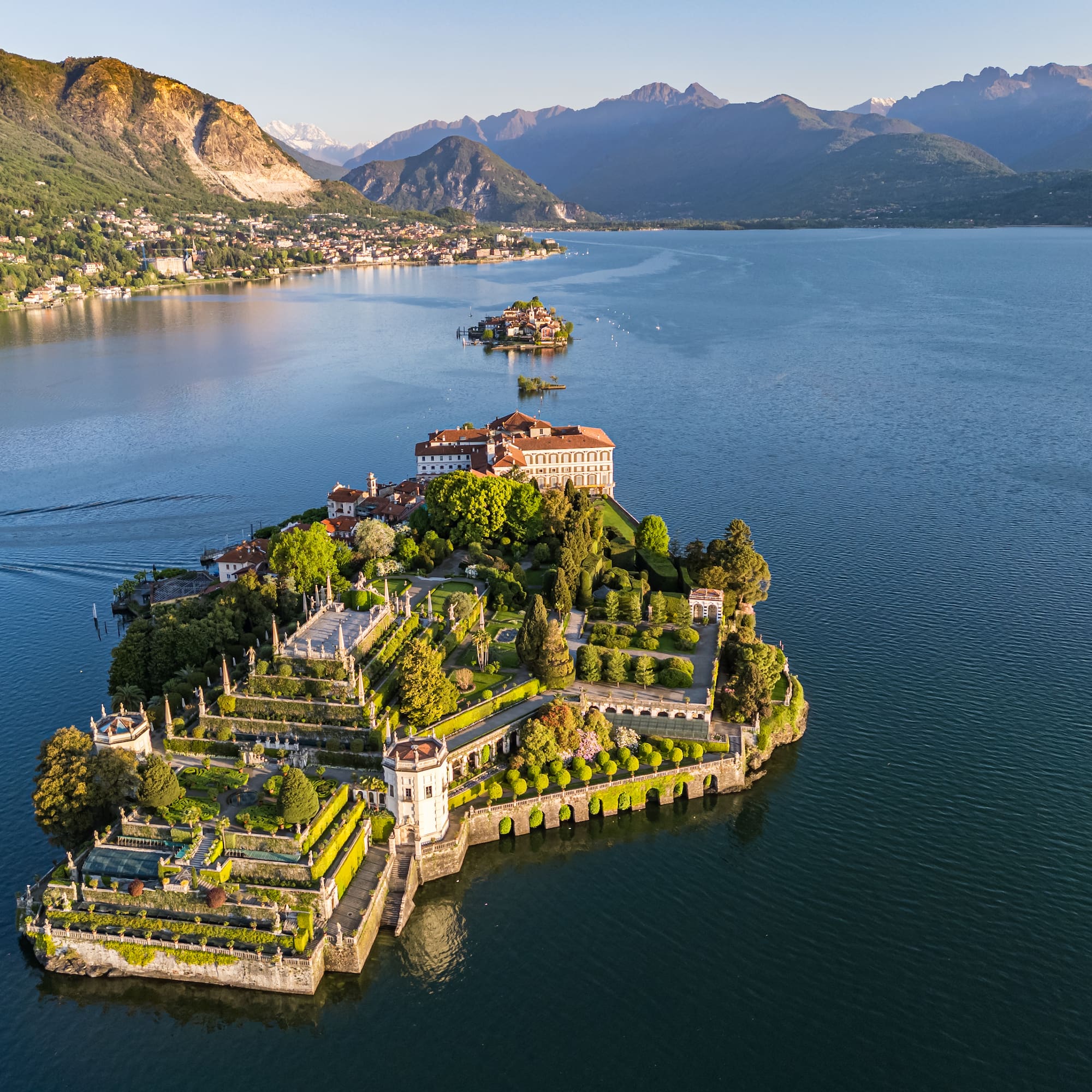 Isola Bella, Lake Maggiore: Baroque palace, elaborate terraced gardens, mountains.