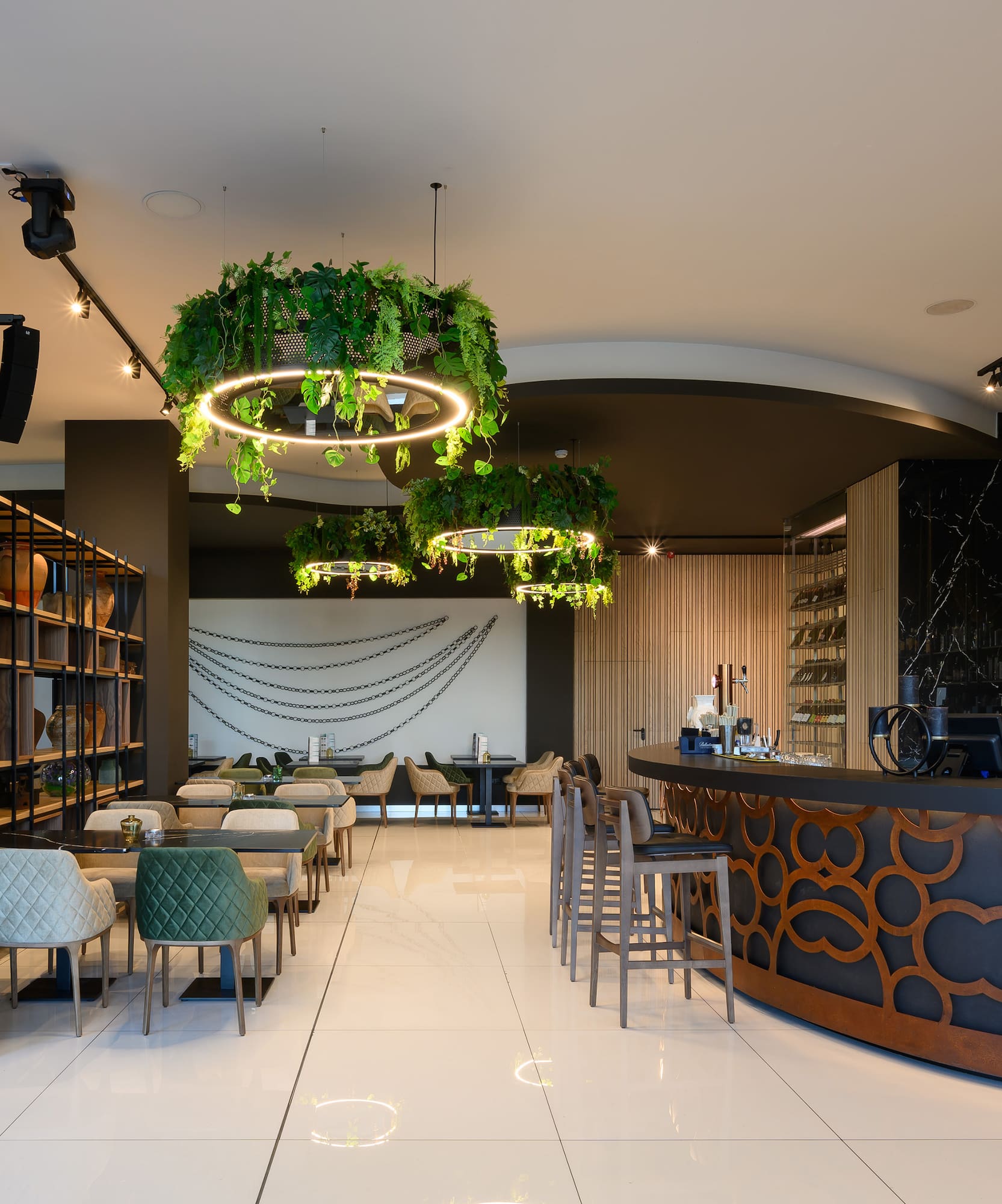 a room with a bar and chairs