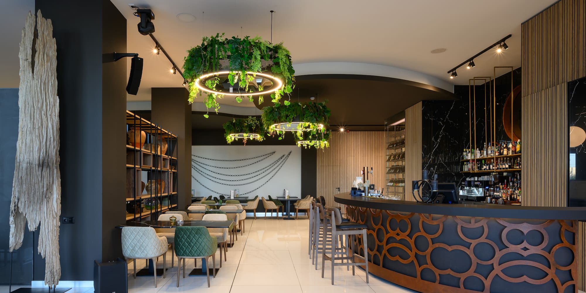 a room with a bar and chairs