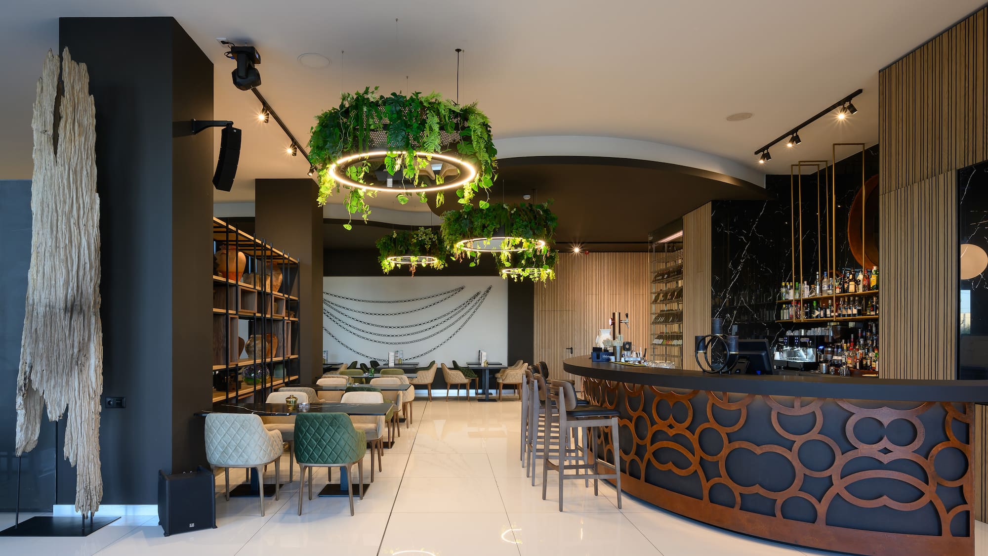 a room with a bar and chairs