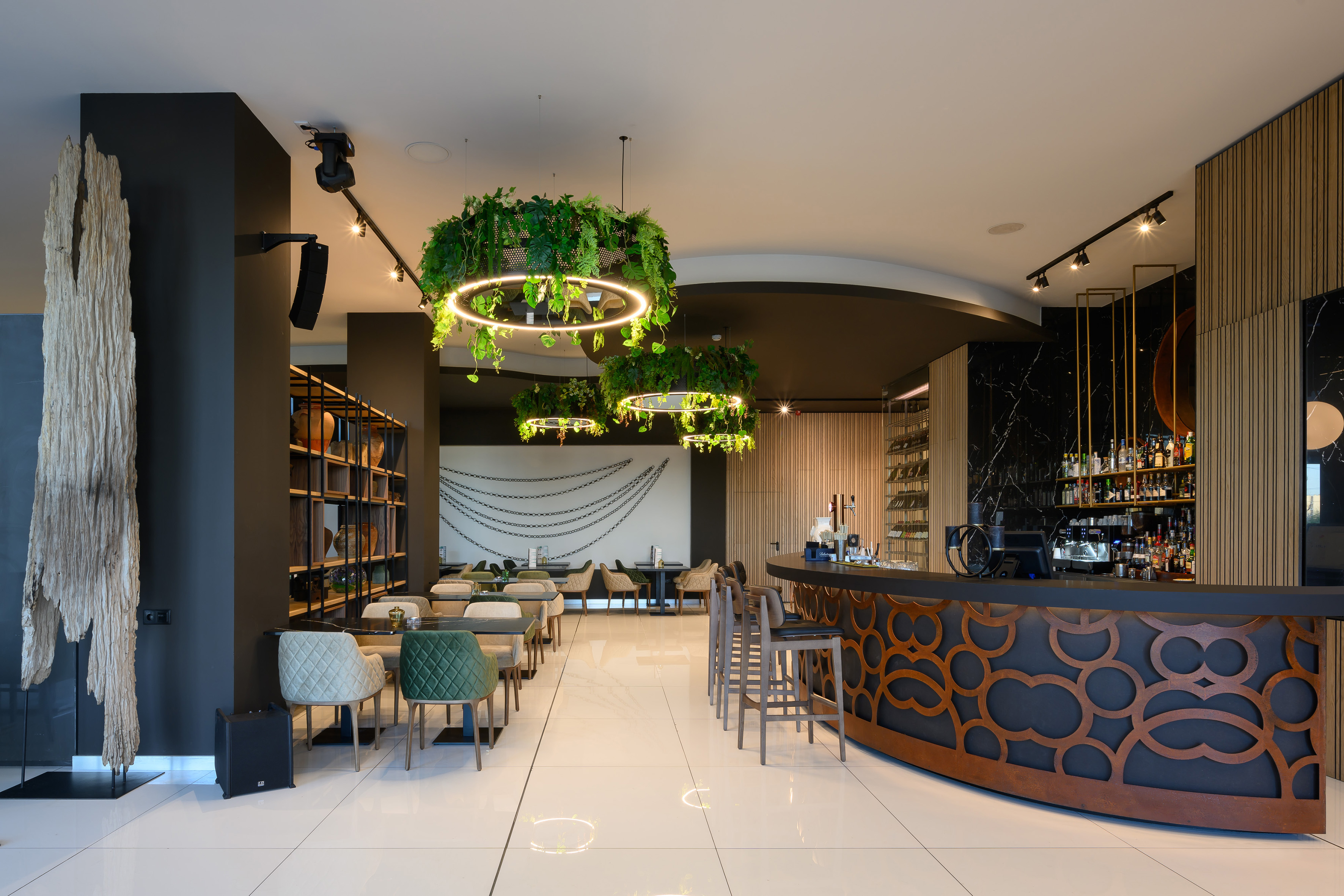 a room with a bar and chairs