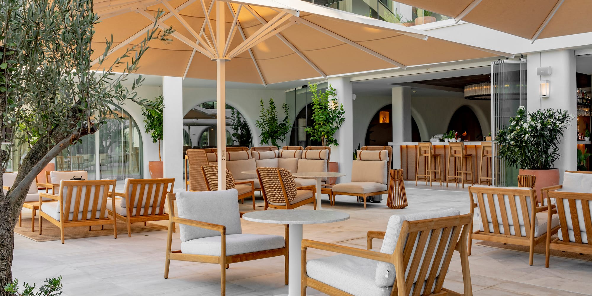 a patio with chairs and a table