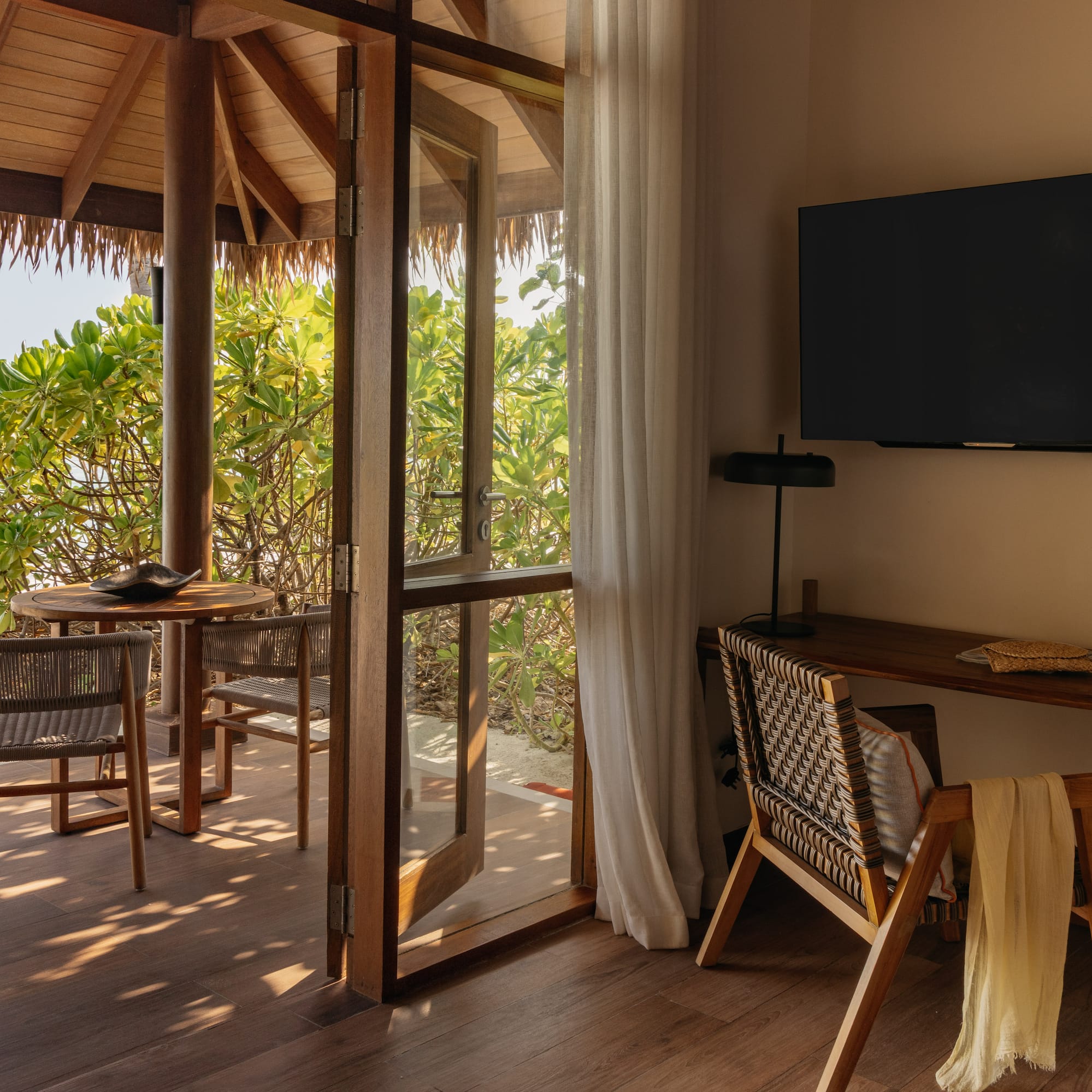 a room with a television and a table