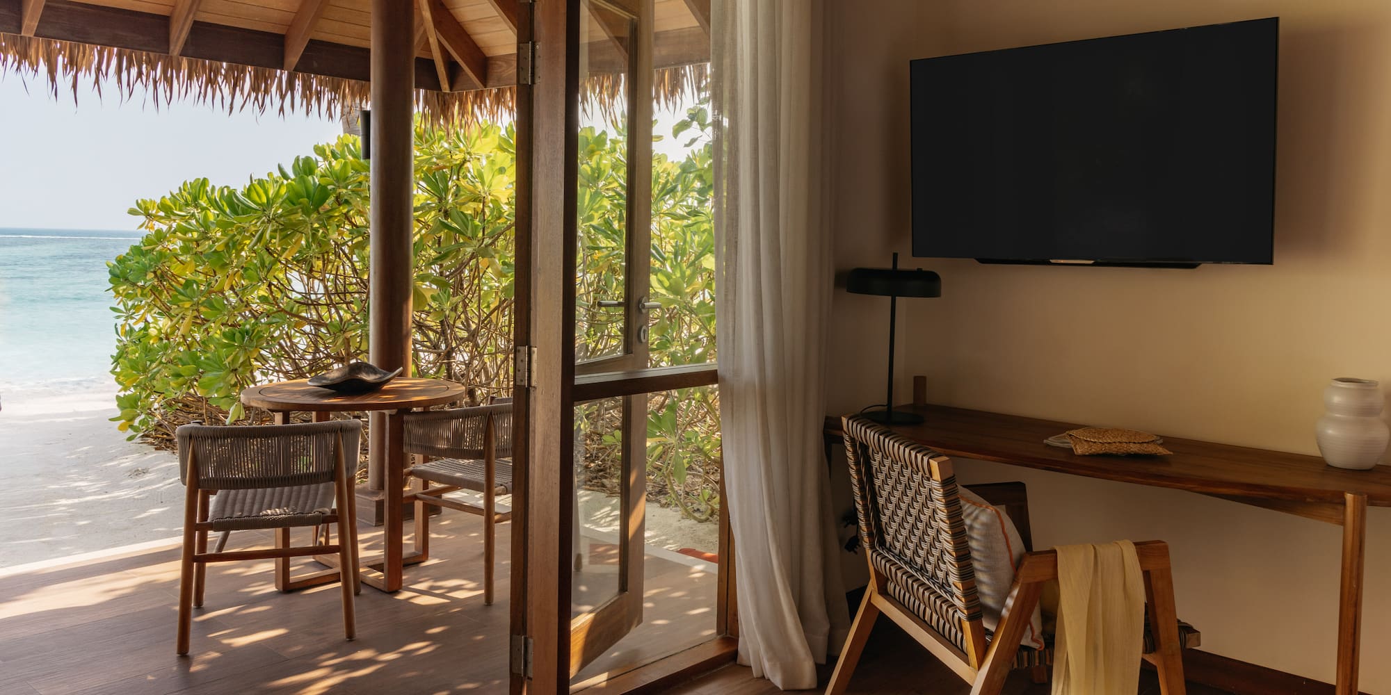 a room with a television and a table