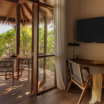 a room with a television and a table