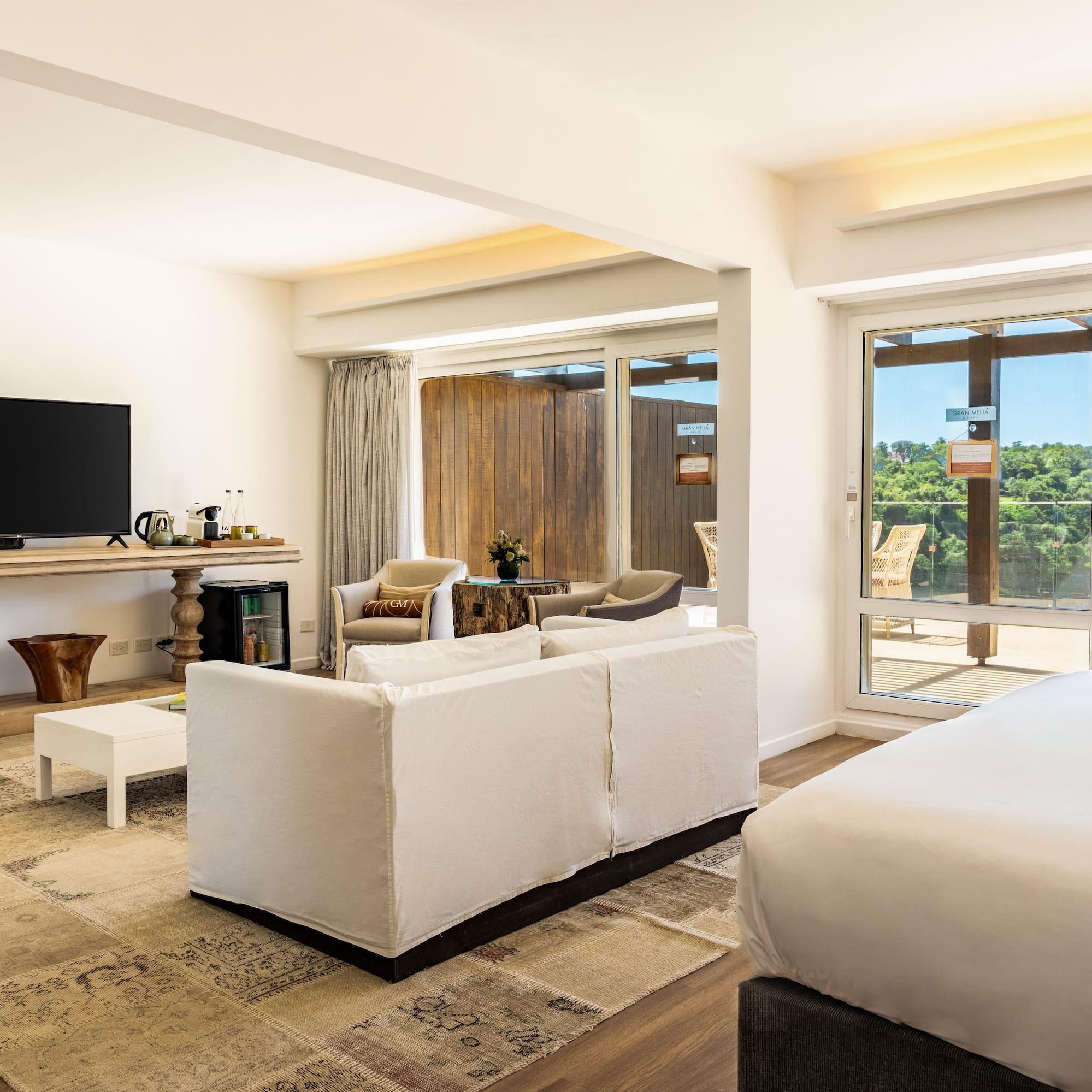 a room with a television and a bed