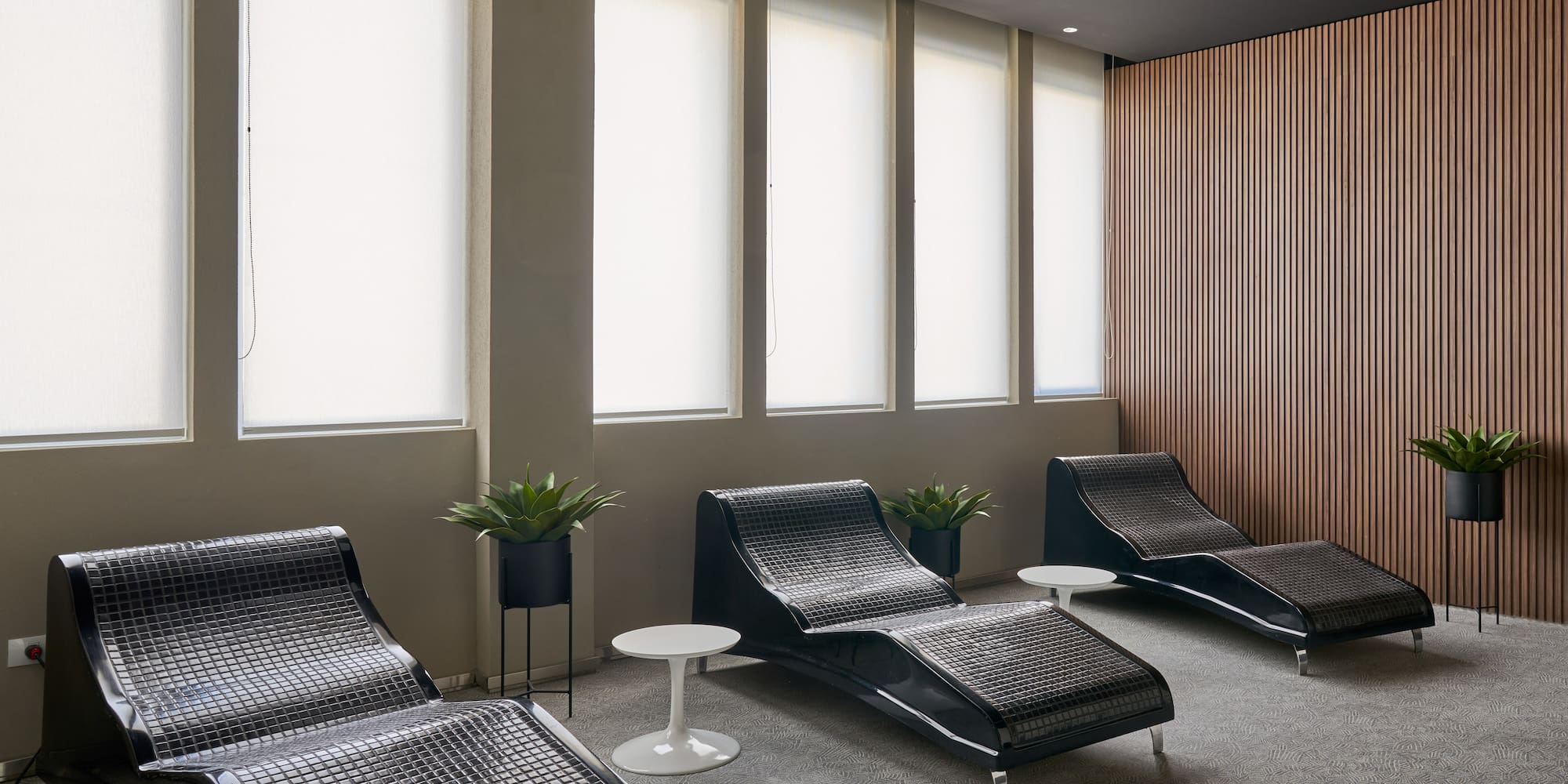 a room with chairs and a window