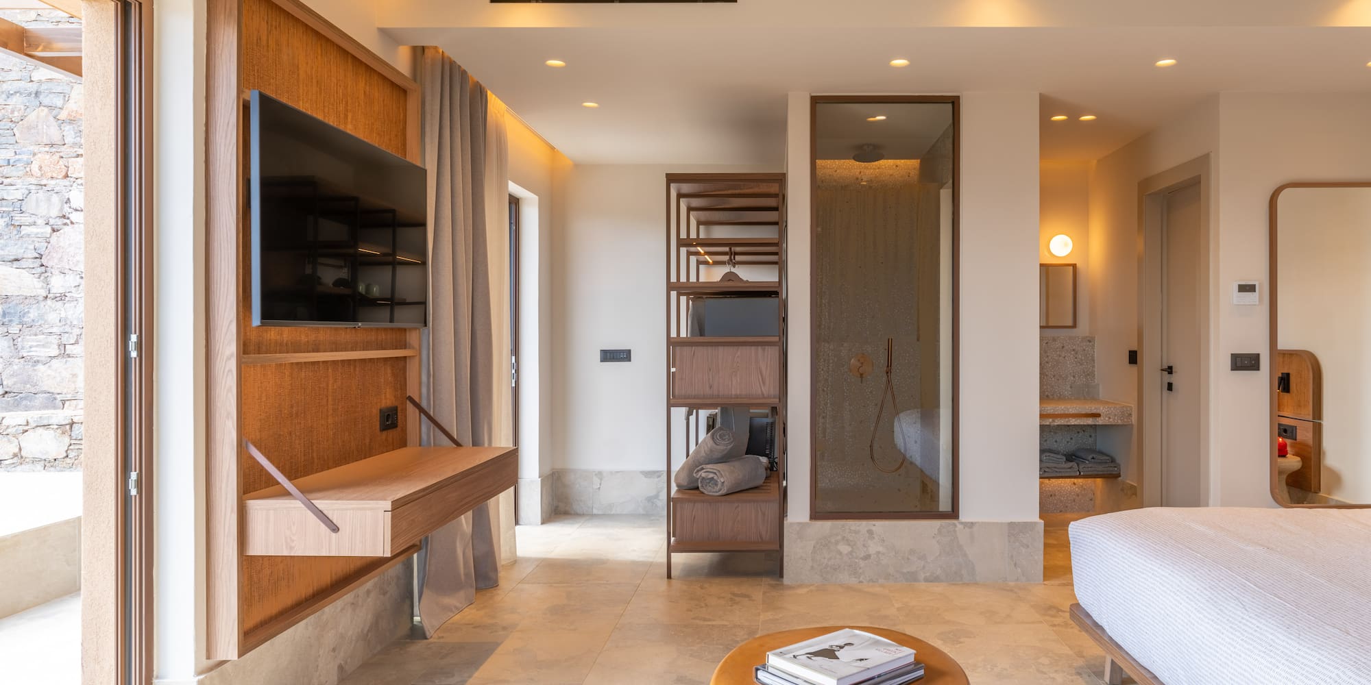 a room with a bed and a tv