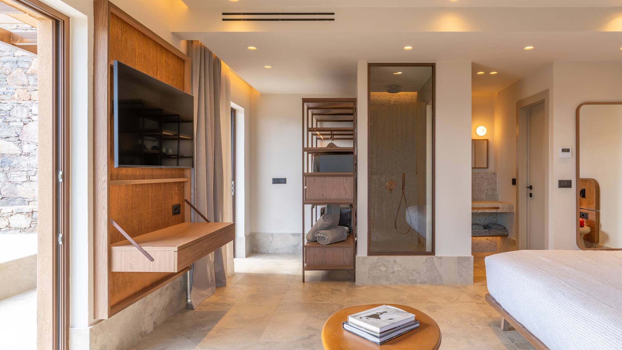 a room with a bed and a tv