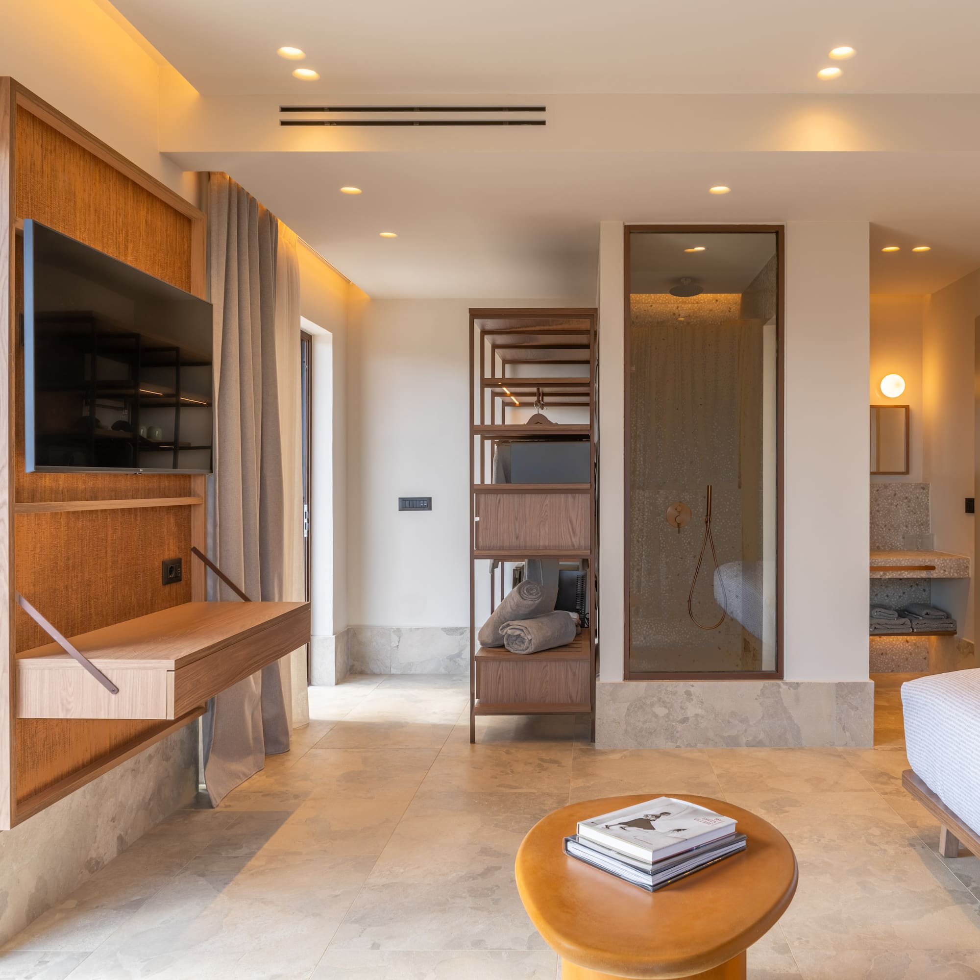 a room with a bed and a tv