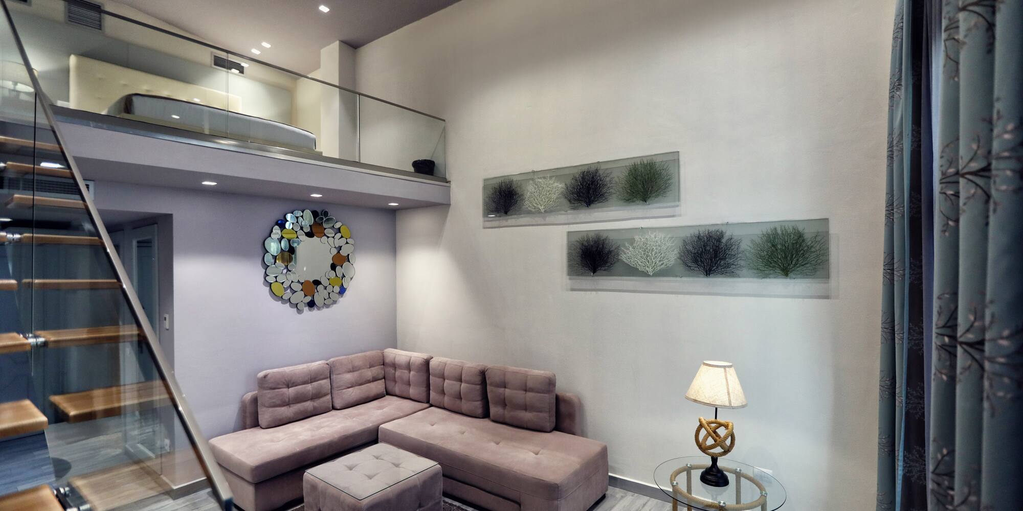 a living room with a couch and a lamp