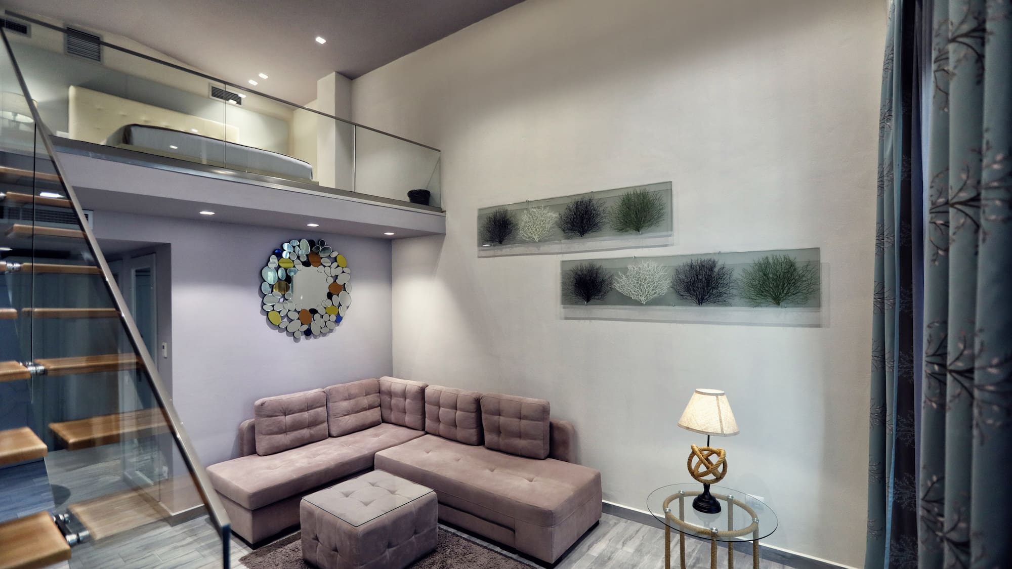 a living room with a couch and a lamp