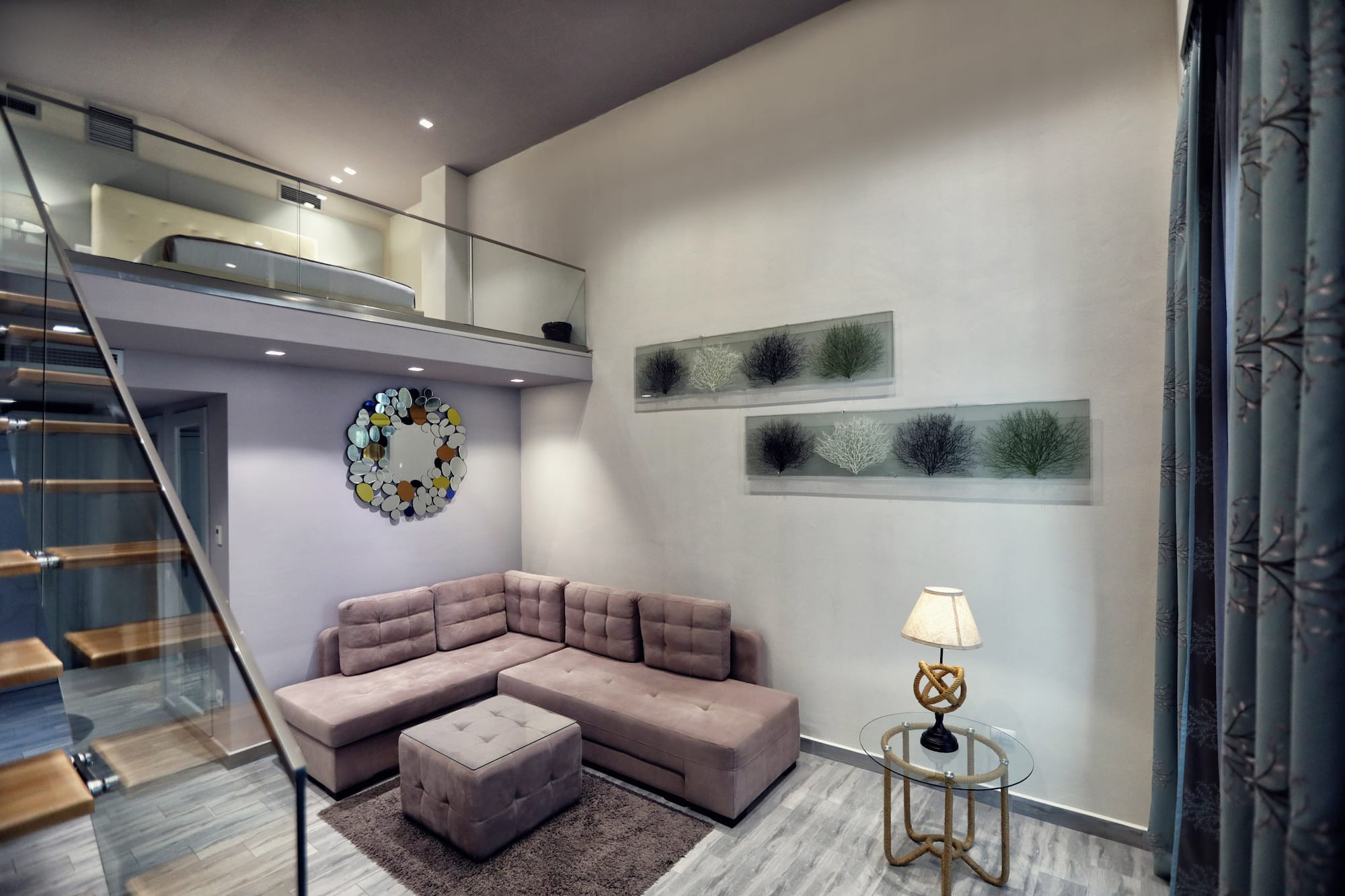 a living room with a couch and a lamp