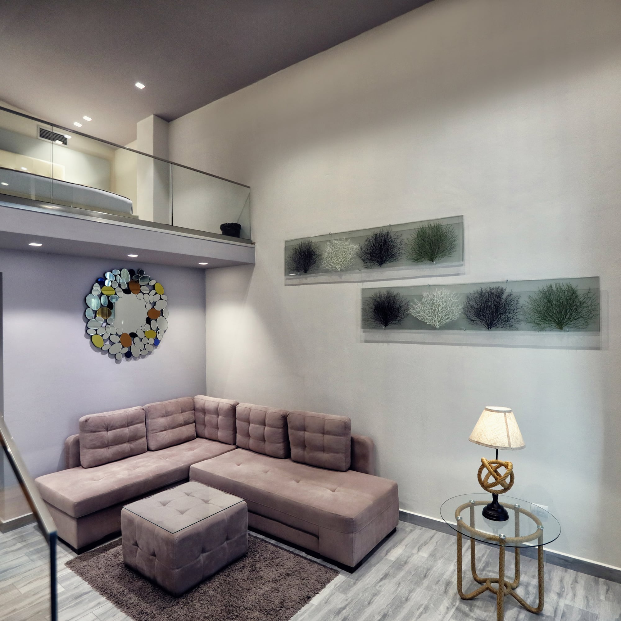 a living room with a couch and a lamp