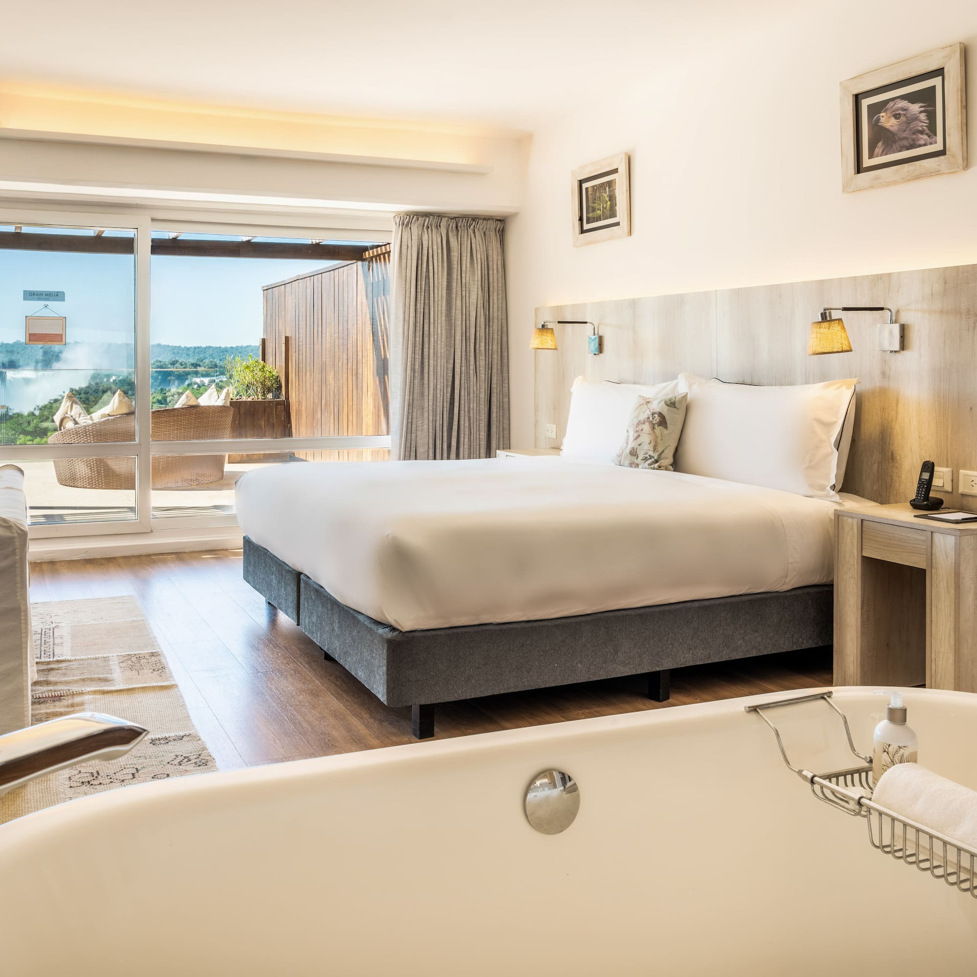 a room with a bed and a bathtub