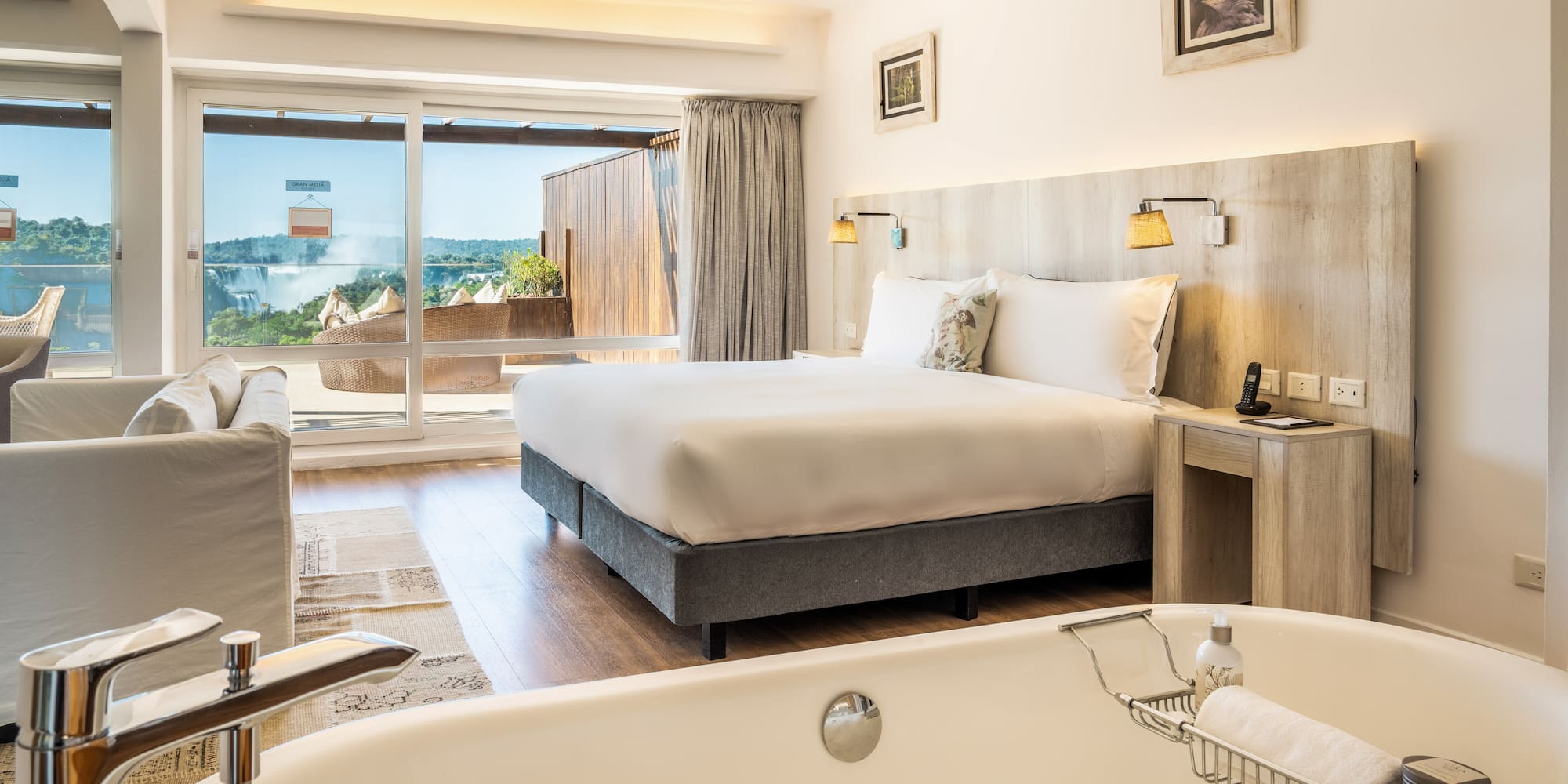 a room with a bed and a bathtub