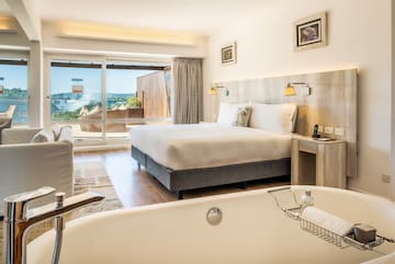 a room with a bed and a bathtub