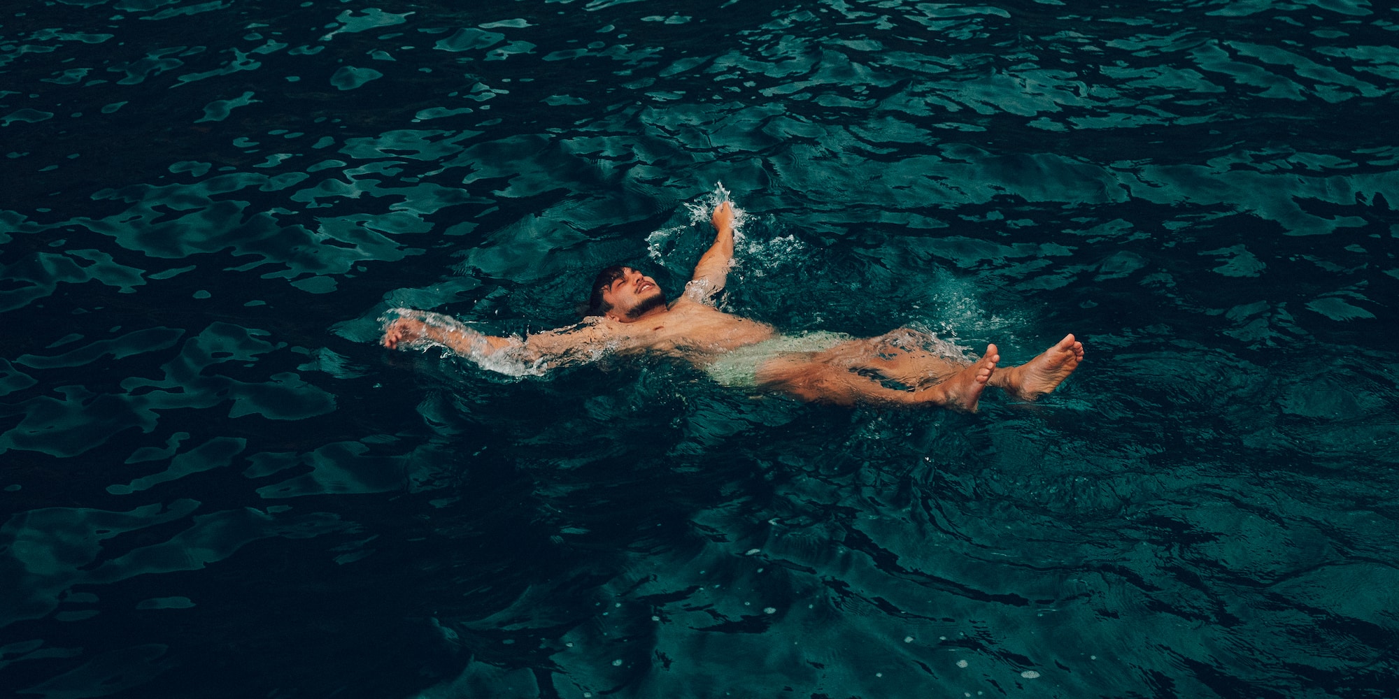 a man swimming in water