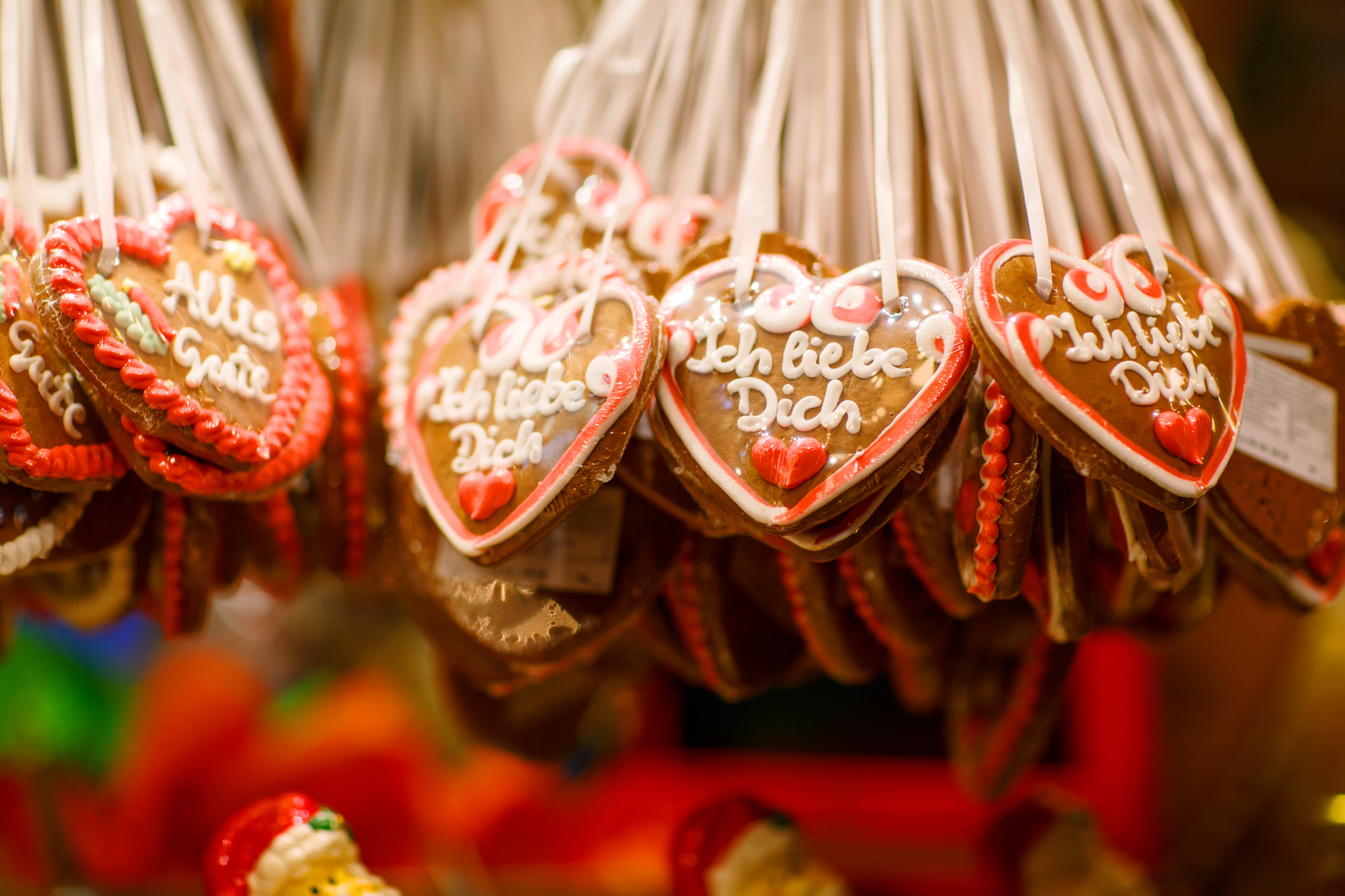 Hanging German gingerbread hearts with "Ich liebe Dich" icing.