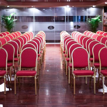 a room with red chairs