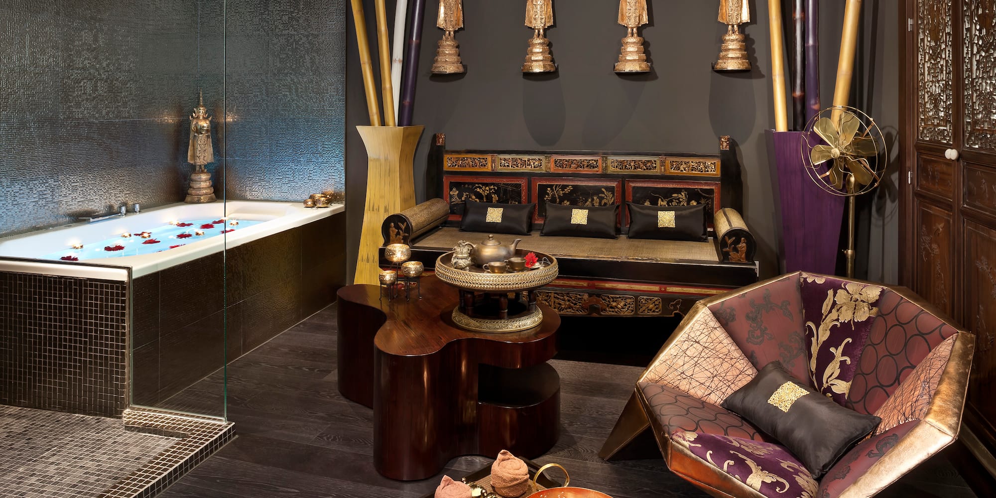 a room with a jacuzzi tub and a couch