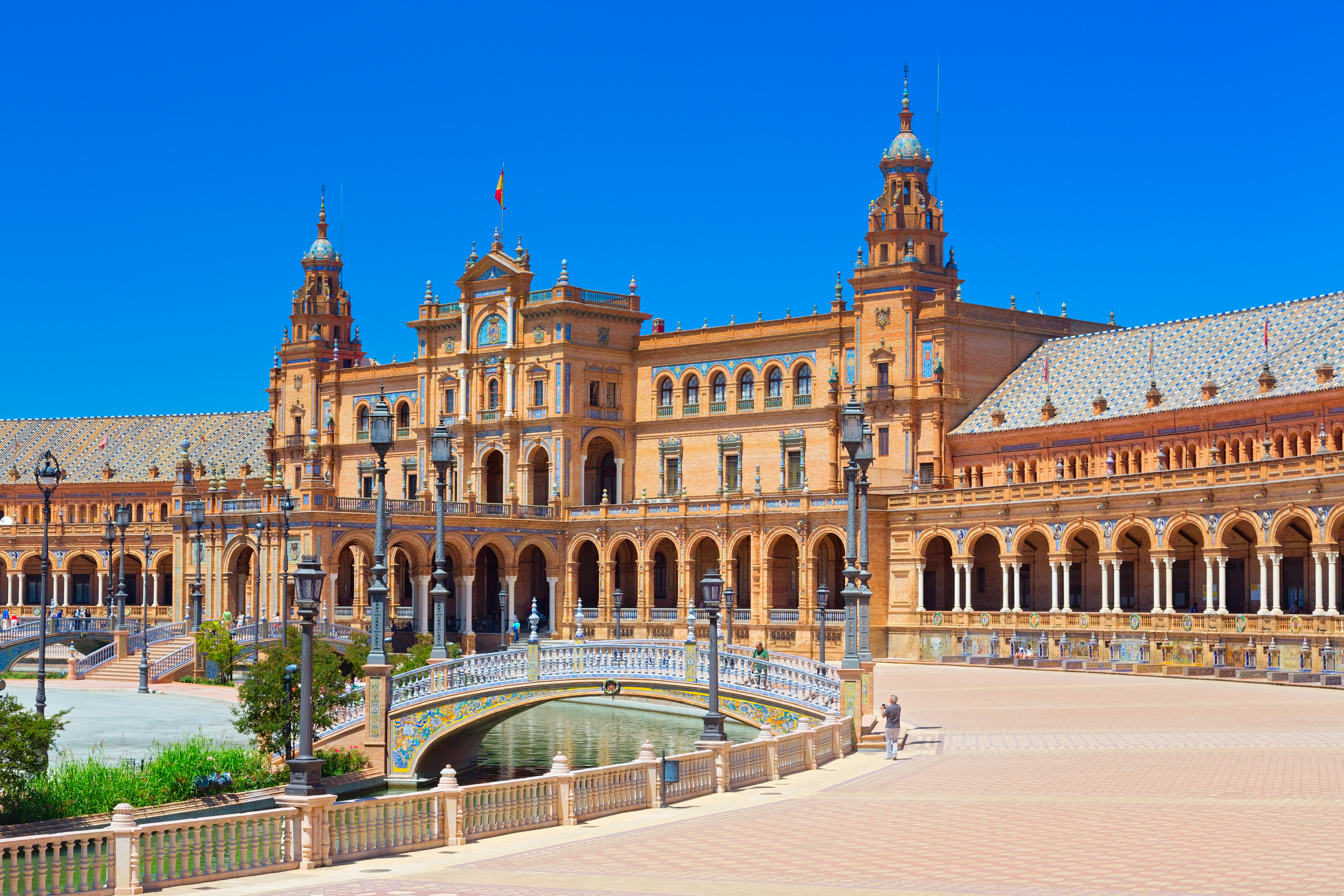 a large building with a bridge and a river