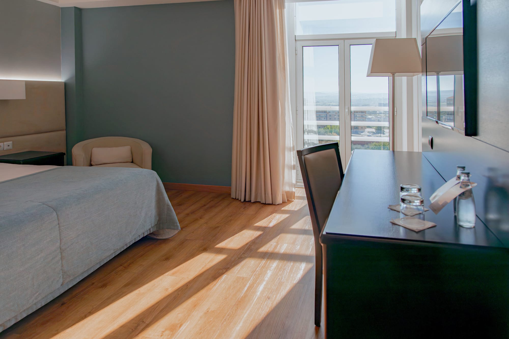 a room with a desk and a bed