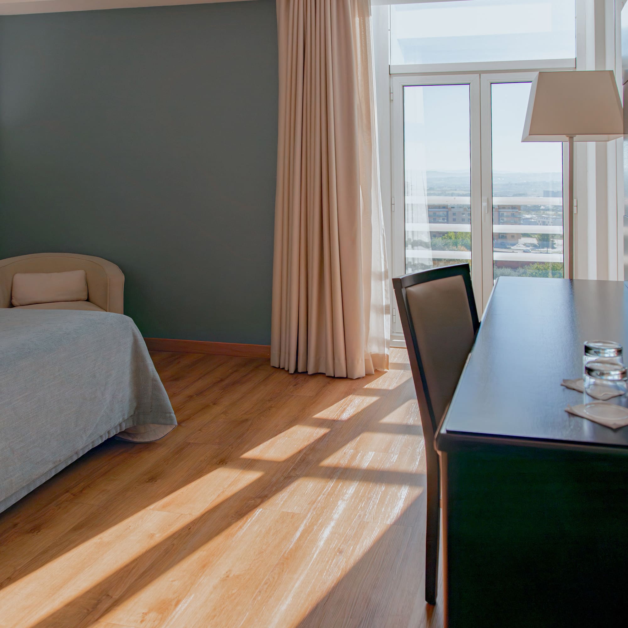 a room with a desk and a bed