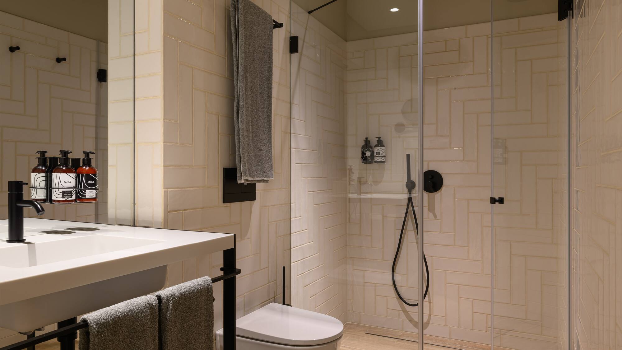 a bathroom with a shower and toilet