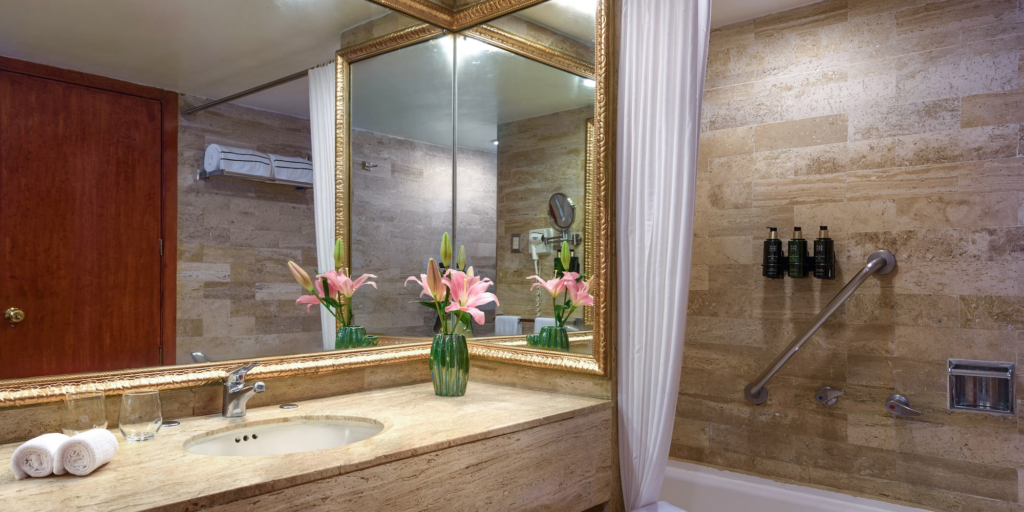 a bathroom with a sink and a mirror