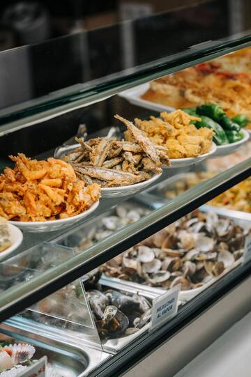 a display case with different types of food
