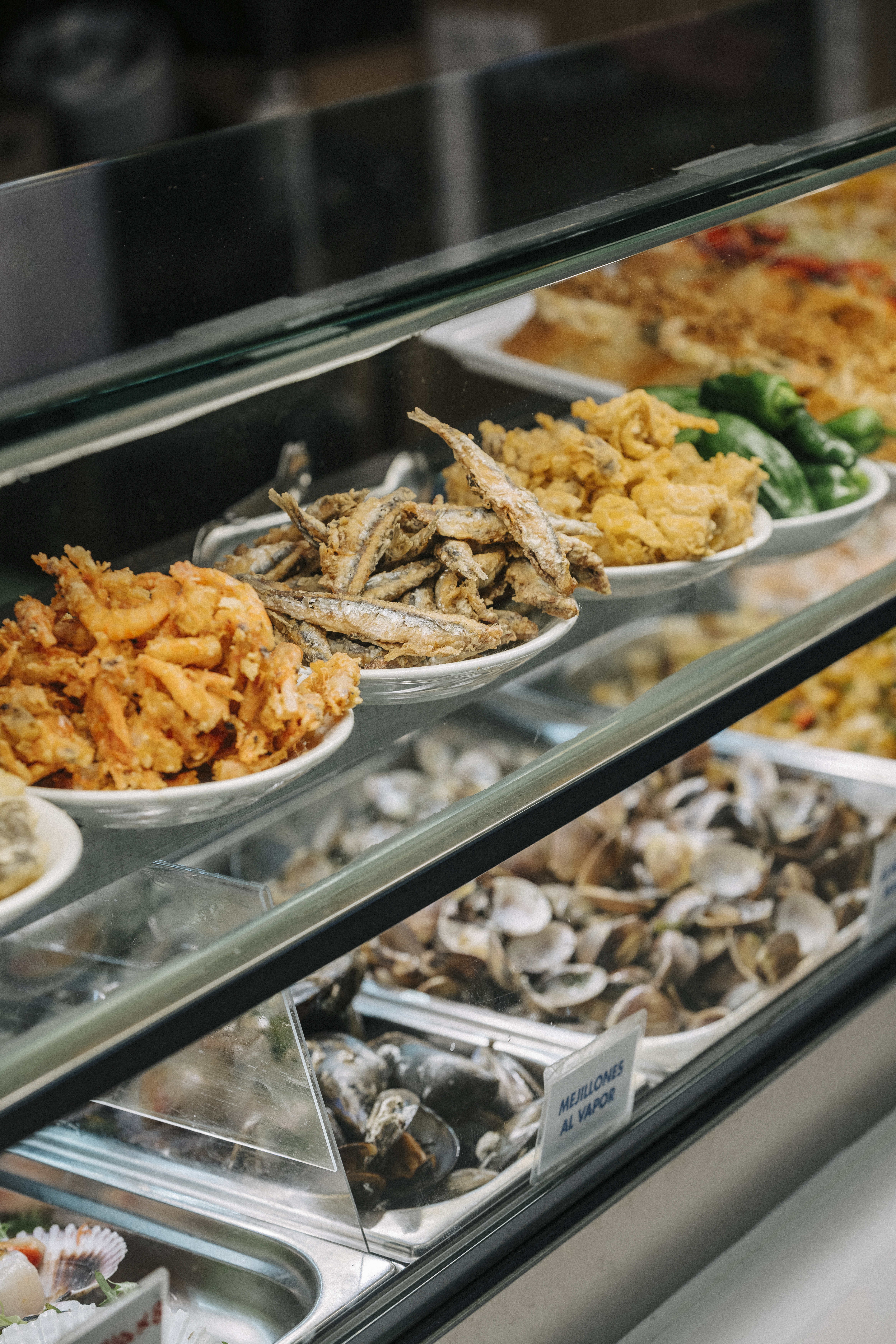 a display case with different types of food