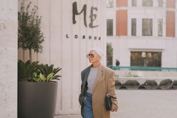 a woman wearing sunglasses and a jacket