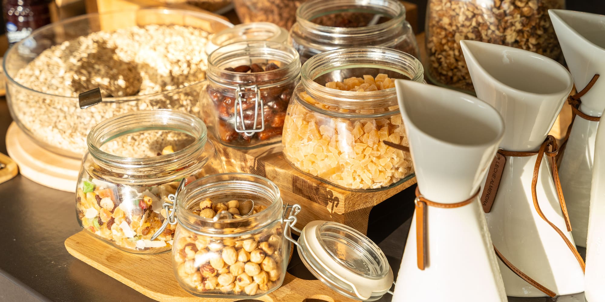 a group of glass jars with food in them